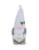 Load image into Gallery viewer, Front angle of the gnome with spring theme. From this perspective, all its features can be fully appreciated: the heart with the term &quot;Be Mine&quot; on it, the white hat with a pink-colored plushy cuff, and the flower with white petals and a yellow central disc. The background of the picture is white.
