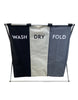 Load image into Gallery viewer, Frontal view of the foldable laundry hamper with three compartments. From this angle, almost all its features are visible: the metal frame, the three sections made of fabric, the black, beige, and gray colors corresponding to each compartment, and the terms &quot;Wash,&quot; &quot;Dry,&quot; and &quot;Fold&quot; placed correspondingly on the black, beige, and gray divisions. The background of the picture is white.
