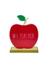 Load image into Gallery viewer, Front view of the desk sign for teachers. It is placed in a standing position. From this angle, its main features can be appreciated: The apple shape, its wooden base, and the phrase #1 Teacher written on it. The background of the picture is white.
