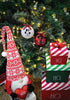 Load image into Gallery viewer, Lifestyle picture of the Christmas ornaments with term &quot;Best Friend&quot; and a dog paw on them. They are hanging on a Christmas tree with lighting bulbs on it, placed next to each other. In front of the tree, there&#39;s a red and white Christmas gnome that holds a red decorative heart. There are also three decorative red, white, and green Christmas boxes on the right side, one above the other. 
