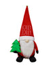 Load image into Gallery viewer, Front angle of the Christmas gnome. In this angle, it can be easily read the term &quot;Holly Jolly&quot; on the gnome&#39;s hat. It also stands out the decorative Christmas tree the gnome holds.
