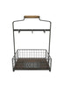 Load image into Gallery viewer, Front view of the organizer for coffee supplies and mugs. In this view, all its features are visible: the open storage basket in the front, the plaque with the word &quot;Coffee&quot; in Rae Dunn font, the bars connecting at the top with the wooden handle, and the flat metal piece with six hooks connected with the bars. The background of the picture is white.
