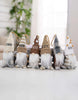 Load image into Gallery viewer, Lifestyle picture of the Gnome-shape ornaments. They&#39;re placed on a white table. 
