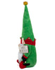 Load image into Gallery viewer, Side view of the Christmas-themed elf gnome. From this perspective, a red crown-shaped band at the base of its hat stands out, nicely contrasting with the green of the hat and jacket. Its red curled-toe shoes also capture attention from this angle. The background of the picture is white.
