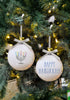 Load image into Gallery viewer, Lifestyle picture of the Hanukkah ornaments. Both are hanging on a Christmas tree while the light from Christmas bulbs is shining on them.
