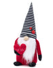 Load image into Gallery viewer, Front angle of the ladybug-themed gnome. In this angle, it can be fully appreciated the plush red heart with the term &quot;Love Bug&quot; on it. It is also noticeable two decorative ladybugs on its hat. Lastly, the background of the photo is white.
