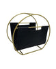 Load image into Gallery viewer, This picture shows the leather magazine holder from a slight side angle, allowing all its features to be appreciated: the gold-colored circular frame with its bars and the leather piece hanging in a curved shape. Lastly, the background of the picture is white.
