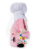 Load image into Gallery viewer, Side angle of the gnome with a teapot. From this view, its body stands out with the plush pink sweater the gnome wears, creating a nice contrast with its flower-themed apron and the white chef hat. The background of the picture is white.
