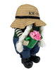 Load image into Gallery viewer, Side angle of the gnome, presented from its right perspective. It has a slight rightward tilt. In this view, the green watering can with pink flowers in it stands out.
