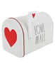 Load image into Gallery viewer, Side angle of the Valentine theme mailbox designed by Rae Dunn. The mailbox is positioned at a 45-degree angle. The structure is white color. It has two illustrations of red hearts, one on the door and the other on the highest part of the flag. The term &quot;Love Mail&quot; is written on the mailbox&#39;s body in a black Rae Dunn font. Lastly, the background of the picture is white. 
