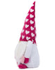 Load image into Gallery viewer, Side angle of the Rae Dunn gnome. From this perspective, the most noticeable feature is the hat with hearts printed on it, which stands out due to its colors and pattern. The background of the picture is white.
