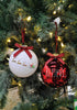 Load image into Gallery viewer, Closer angle of these &quot;Believe&quot; Christmas ornaments hanging on a Christmas tree. Placed next to each other, in this angle it can be appreciated that the lights in the tree are reflected on the ornaments, creating a shining effect.
