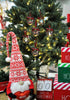 Load image into Gallery viewer, Lifestyle photo exhibiting the Christmas clear ornaments. They are hanging on a Christmas tree with lighting bulbs on it. In front of the tree, there&#39;s a red and white Christmas gnome that holds a red decorative heart. There are also three decorative red, white, and green Christmas boxes on the right side, one on top the other. Next to the boxes, there&#39;s a decorative calendar with the term &quot;Days &#39;Till Christmas&quot; on it.
