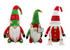 Load image into Gallery viewer, Frontal angle of the set of three elf gnomes. It can be distinguished the terms &quot;Mr. Elf&quot; and &quot;Mrs. Elf&quot; on the hats of each of the larger gnomes, and also, a little bit slanted, the sign held by the smaller gnome with the term &quot;Santa&#39;s Workshop.&quot;
