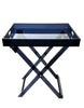 Load image into Gallery viewer, Front view of the acrylic table with a black translucent finish. In this view, all its features are visible: the foldable legs, the rectangular shape with raised edges, the sleek black translucent surface, and the handles on the shorter sides. The background of the picture is white.
