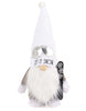 Load image into Gallery viewer, Front angle of the snowboarding gnome. It is noticeable its prominent white beard and a black snowboard the gnome is holding.
