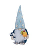 Load image into Gallery viewer, Front view of the beach day summer gnome. In this view, all its main features can be appreciated: the swim ring that it holds in its right hand, the pina colada-like drink in the other hand, and the seashell decorations on its hat. Its navy blue sweater and the sky blue and white striped pattern on the hat can also be appreciated. The background of the picture is white.
