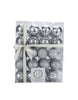 Load image into Gallery viewer, Front angle of the package with the silver tree balls. This package is made with a transparent plastic, permitting to see the ornaments within. It is adorned with a white ribbon that have gold-colored borders.
