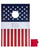 Load image into Gallery viewer, Frontal view of the American flag-themed cornhole board. From this angle, all its features are visible: the navy blue top with white star illustrations, the middle white stripe featuring the term &quot;Toss,&quot; and the red-and-white striped bottom. To its right, a red bean bag is visible. The background of the picture is white.
