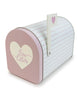 Load image into Gallery viewer, Side angle of the Valentine mailbox. Positioned at a 45-degree angle, this view allows appreciation of the entire mailbox, including its body, flag, and front door. Thanks to this perspective, all the mailbox features can be observed: the heart on the door with the phrase &quot;Love Letters,&quot; the body with the horizontal hatch patterned lines, and the small heart on the flag. 
