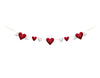 Load image into Gallery viewer, Frontal view of the Valentine-themed garland. The garland is stretched, allowing us to envision how it would appear when hung. The seven hearts on the garland are clearly visible, and the photo has a white background.
