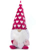 Load image into Gallery viewer, Front angle of the Valentine&#39;s Day-themed gnome. The three plush hearts that the gnome is holding are placed at its front, making this feature better appreciated from this angle. Lastly, the background of the photo is white.
