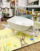 Load image into Gallery viewer, Décor Easter Wheelbarrow - Side angle with Easter eggs in it
